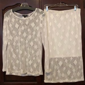 Sheer, white long sleeved top/skirt set.